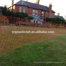 Orange arena fencing or plastic boundary, barrier mesh fencing, metal stakes